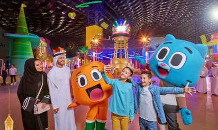 Kids taking a selfie with family and cartoon characters at IMG Worlds during the Ramadan Special, capturing a joyful moment.